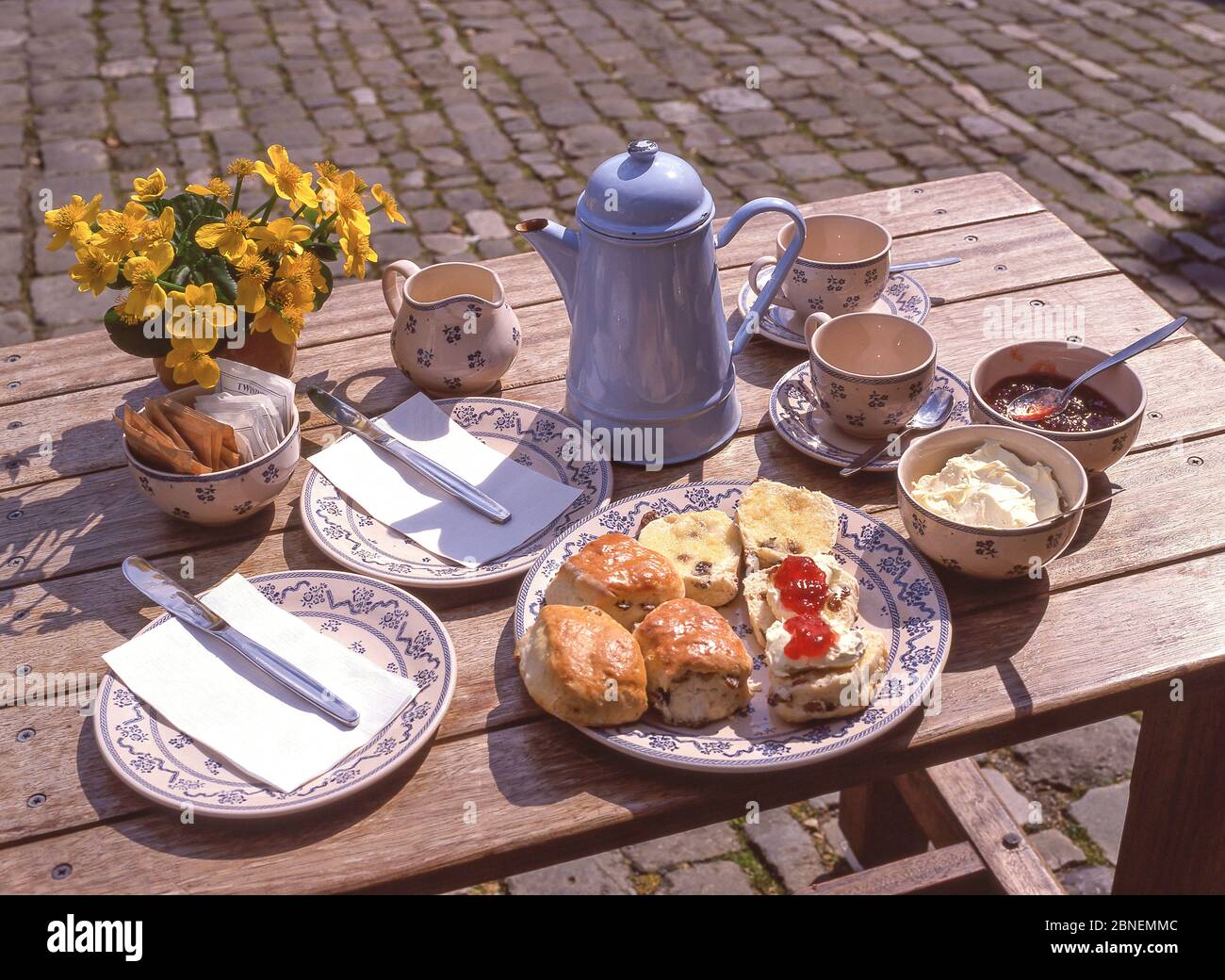 Afternoon cream tea on table at top of Gold Hill, Shaftesbury, Dorset, England, United Kingdom Stock Photo