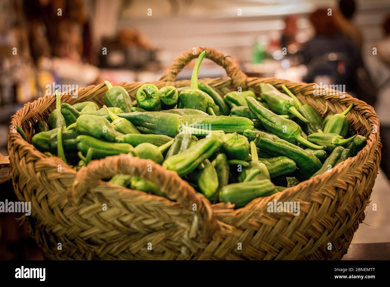 Lot of fresh green serrano pepper in a basket Stock Photo