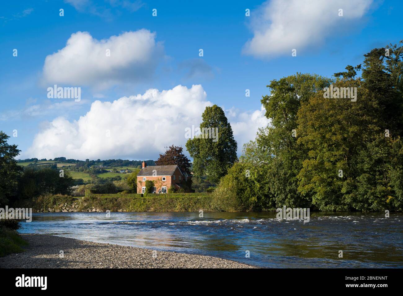 Riverside home in typical Welsh landscape by the River Wye in the Brecon Beacons in Wales, UK Stock Photo