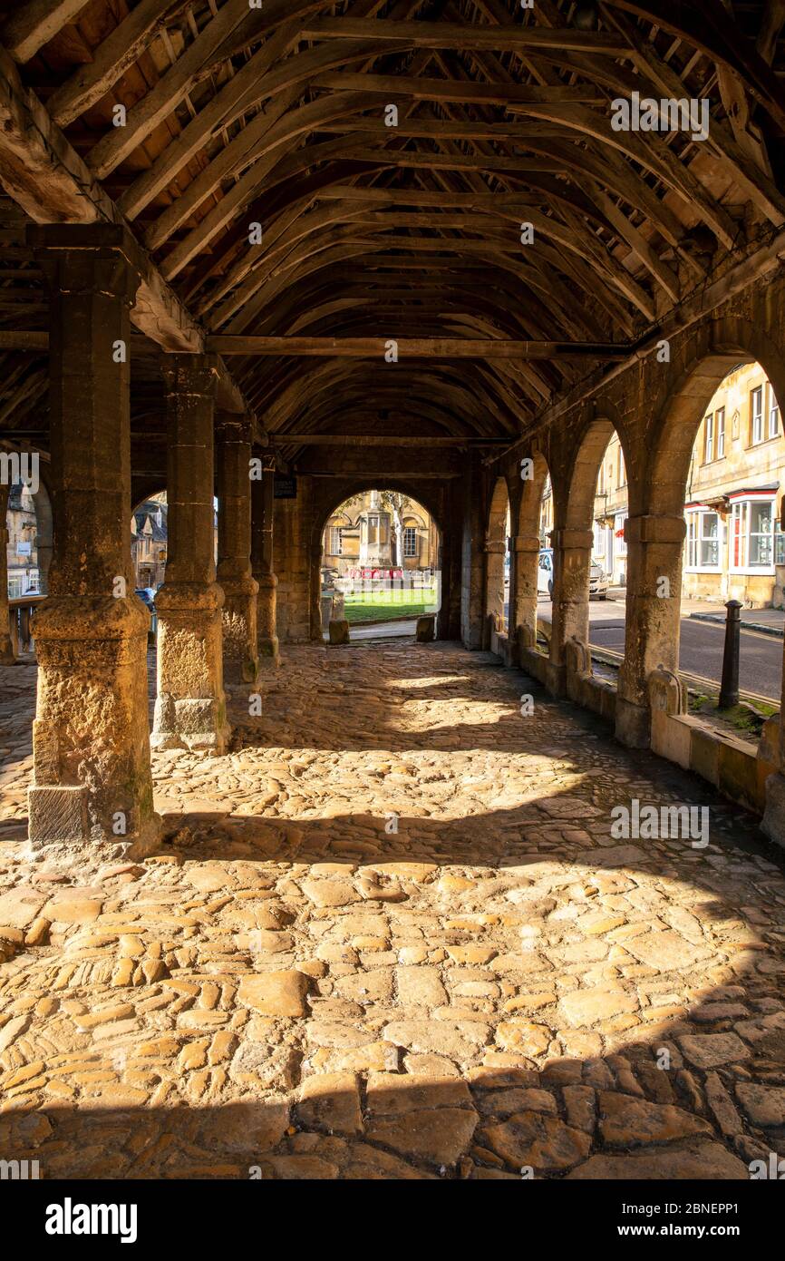 Old stone flagstones and timber beams, joists, rafters and purlins of the 17th Century Market Hall in Chipping Campden in The Cotswolds, Oxfordshire, Stock Photo