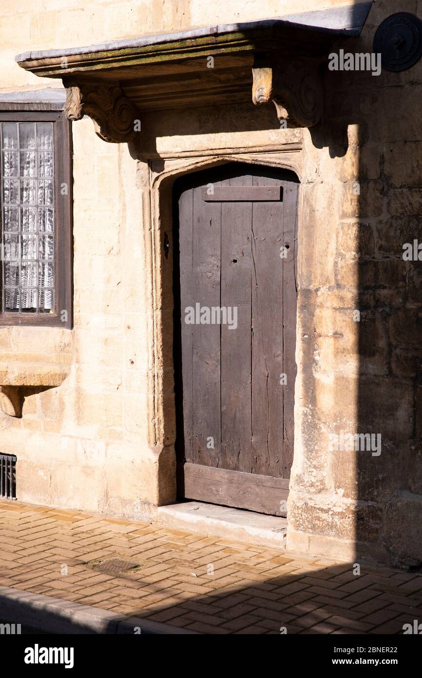 Old timber front door on the High Street in popular tourist town Chipping Campden in The Cotswolds, Oxfordshire, UK Stock Photo