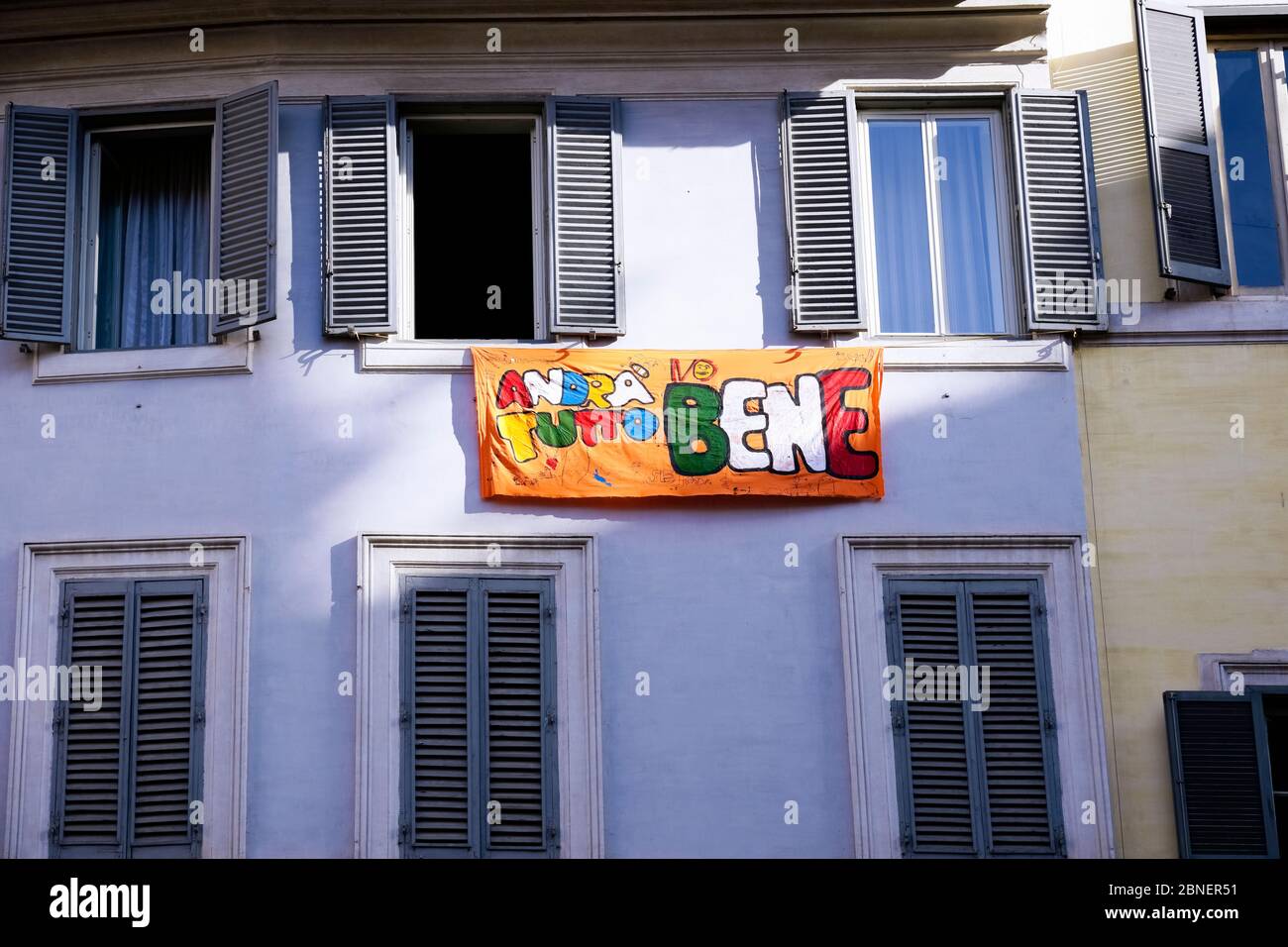 Andrà tutto bene (everything will be all right) banner hanging outside the window, during Coronavirus lockdown. Rome at the time of Covid 19. Italy EU Stock Photo