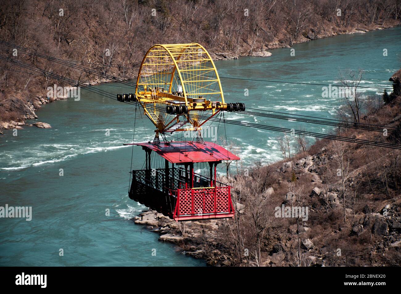 An empty Whirlpool Aero Car  crosses the Niagara River near Niagara Falls. Concept of travel during the pandemic, and reopening the U.S. Canada border. Stock Photo