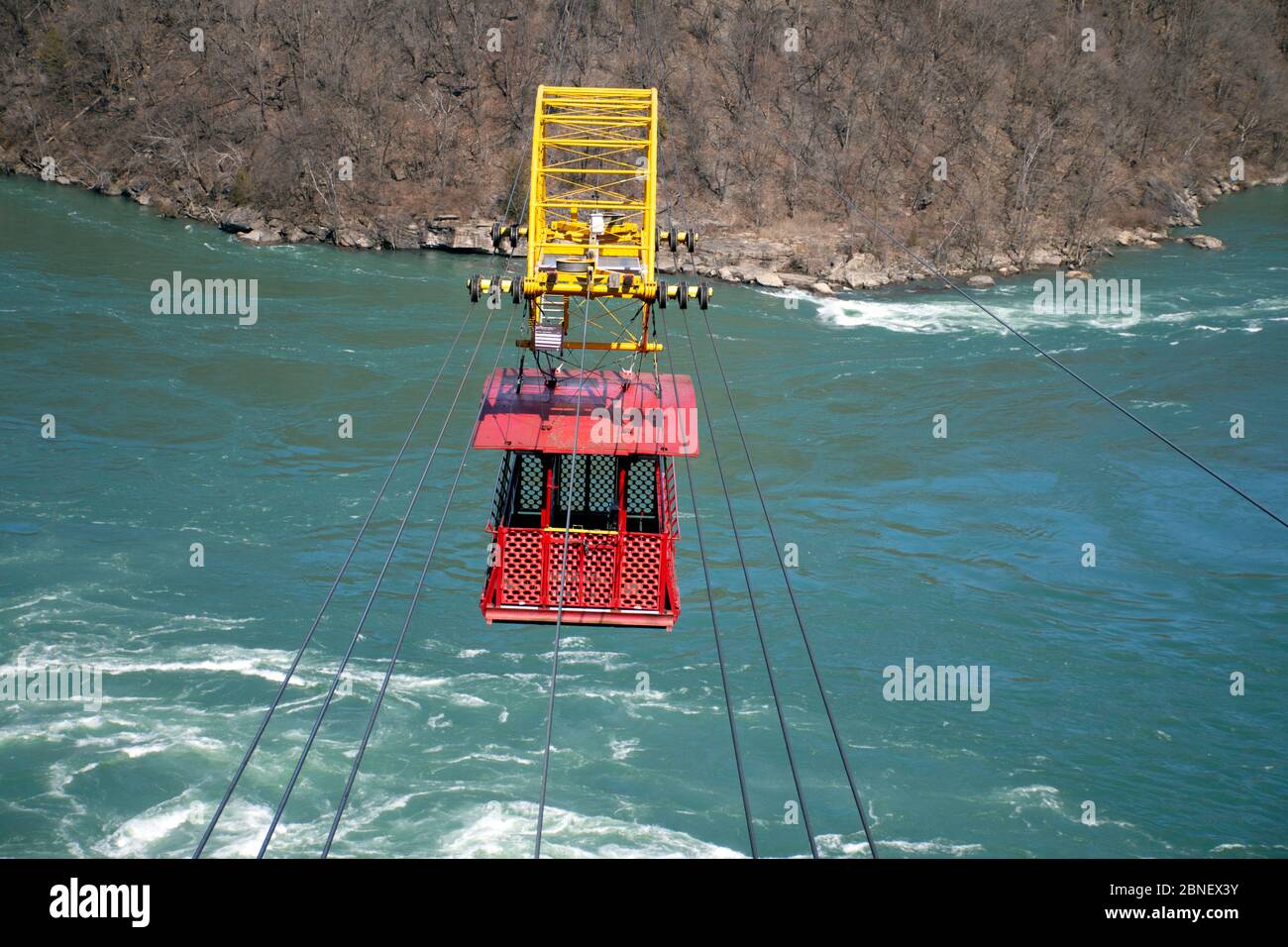 An empty Whirlpool Aero Car  crosses the Niagara River near Niagara Falls. Concept of travel during the pandemic, and reopening the U.S. Canada border. Stock Photo