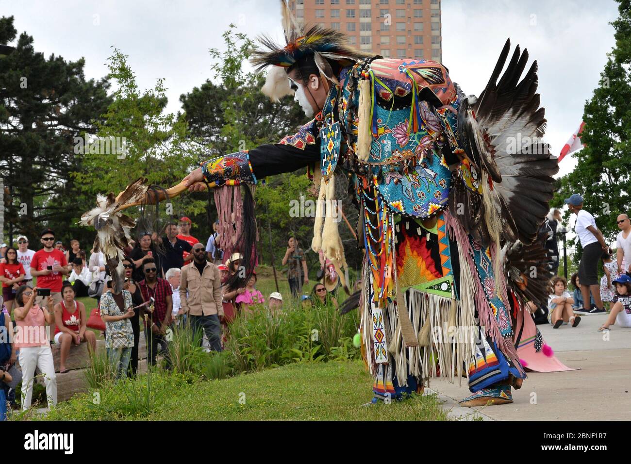Toronto, Ontario / Canada - July 01, 2017: Indigenous native People in traditional Native Canadian clothing performing the traditional dance in the Ca Stock Photo