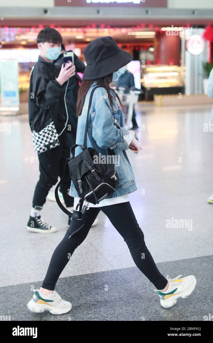 actress Tan Songyun arrives in an airport in Beijing, China, April 17, 2020. Bag: Burberry Shoes: Balenciaga Stock Photo - Alamy