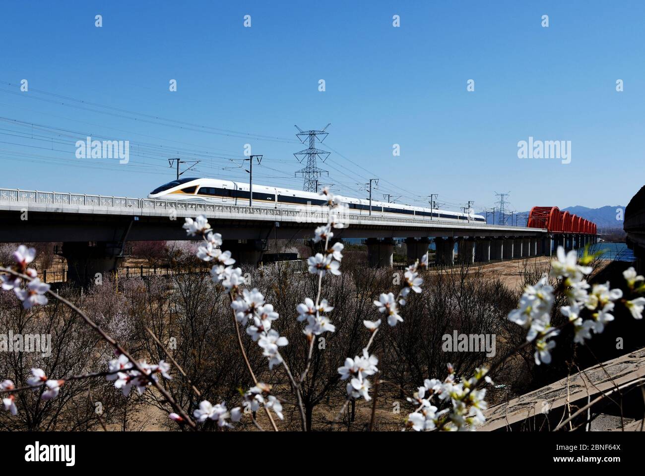 A view of a train of Fuxing Hao, also known as the CR series EMU, running  on the Guanting Reservoir Bridge of Beijing-Hohhot Railway, Huailai county  Stock Photo - Alamy