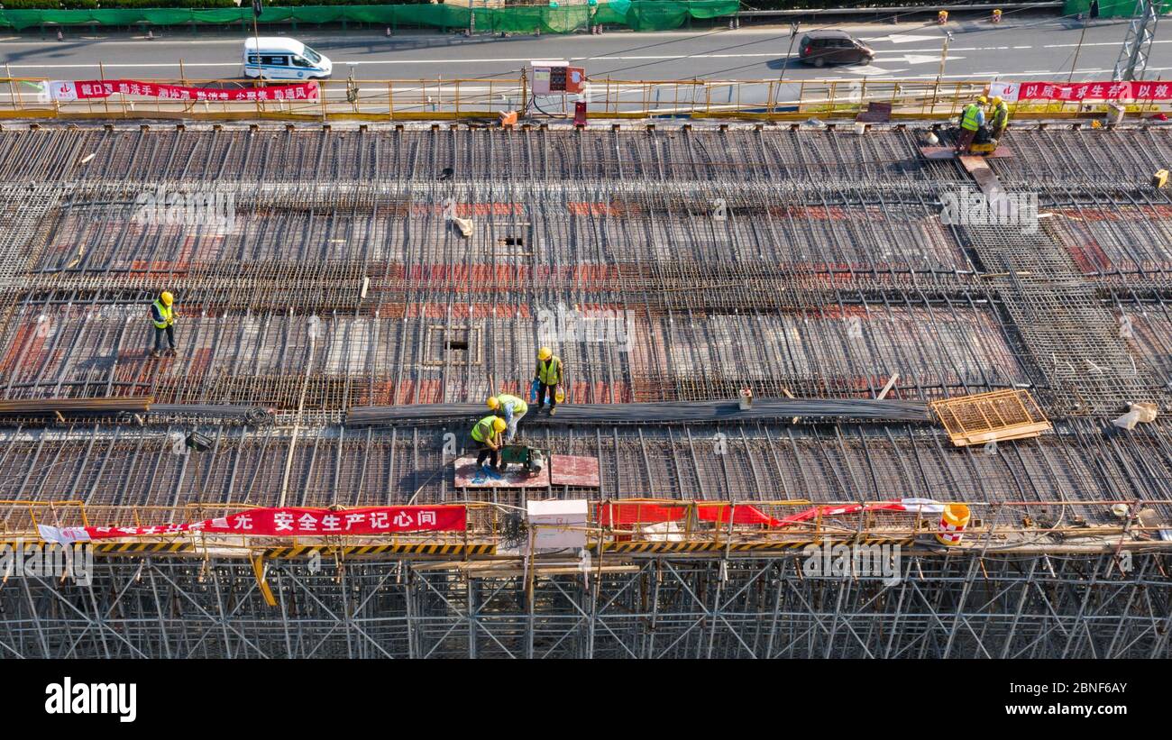 Fly Over Construction Ramp An aerial view of workers busy at the construction site to build the to ...