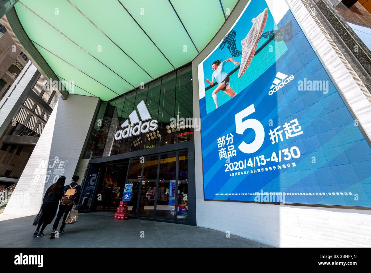 The exterior view of an Adidas store, which launches 50% off promotion to  attract customers, Shanghai, China, 24 April 2020. *** Local Caption ***  fac Stock Photo - Alamy