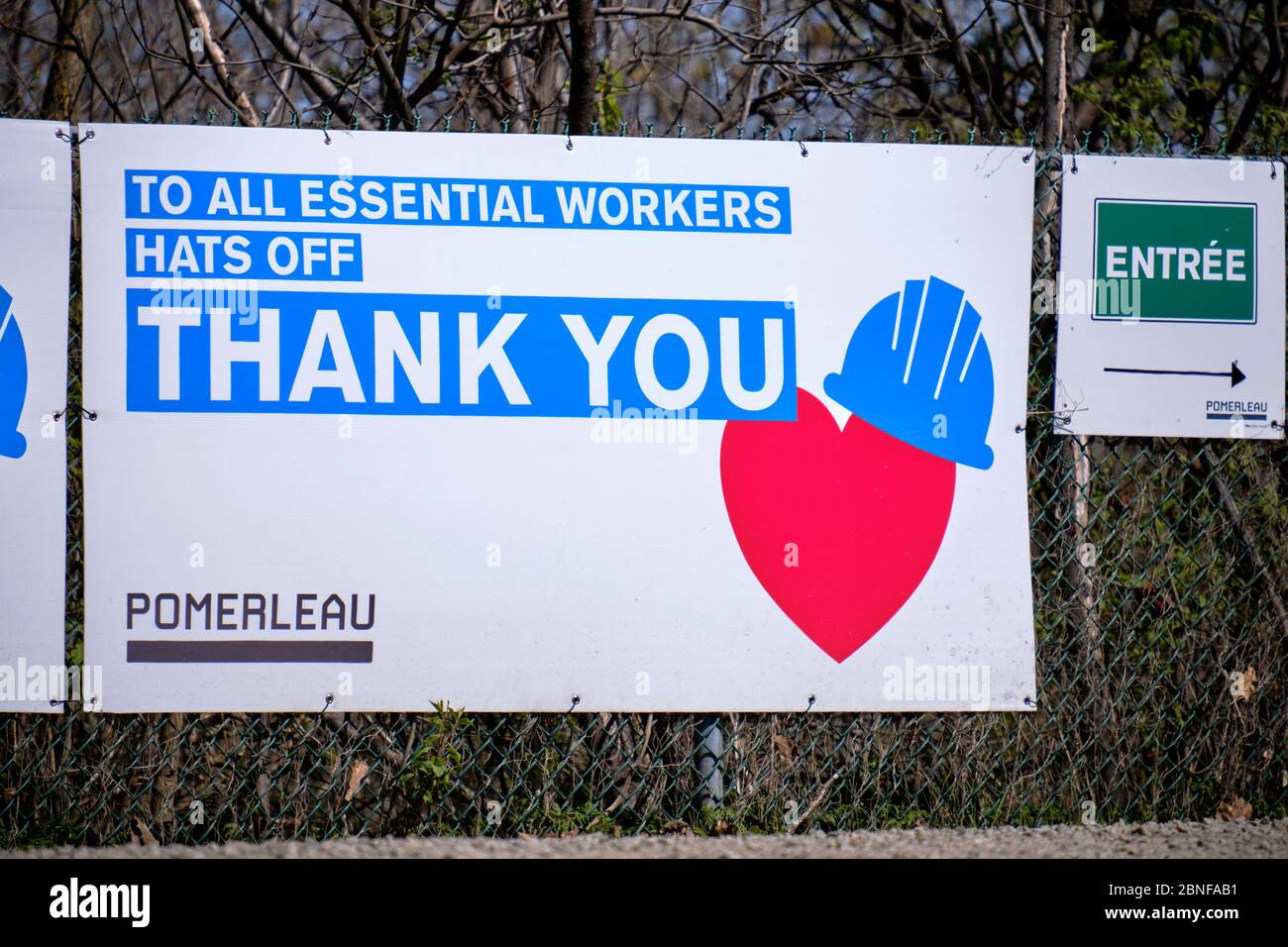 Thank you to all essential workers at entrance of Hospital extension construction site in Montreal Stock Photo