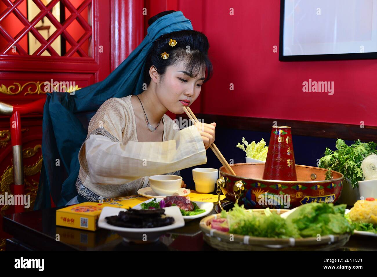 Customers In Ancient Chinese Clothing Muster At A Hotpot Restaurant 