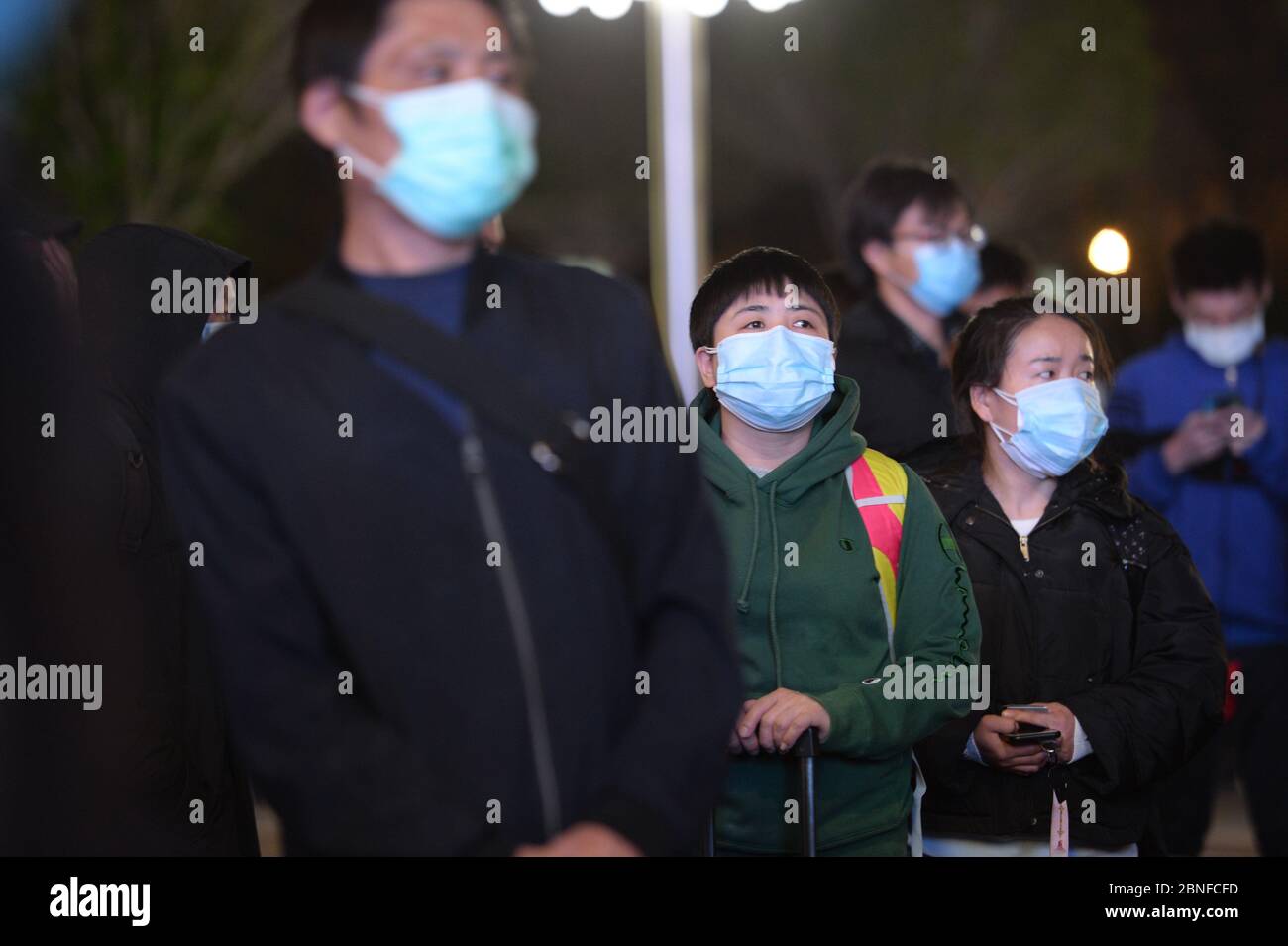 Passengers wait at the train station to leave the city as the lockdown ends, Wuhan city, central China's Hubei province, at midnight of 8 April 2020. Stock Photo