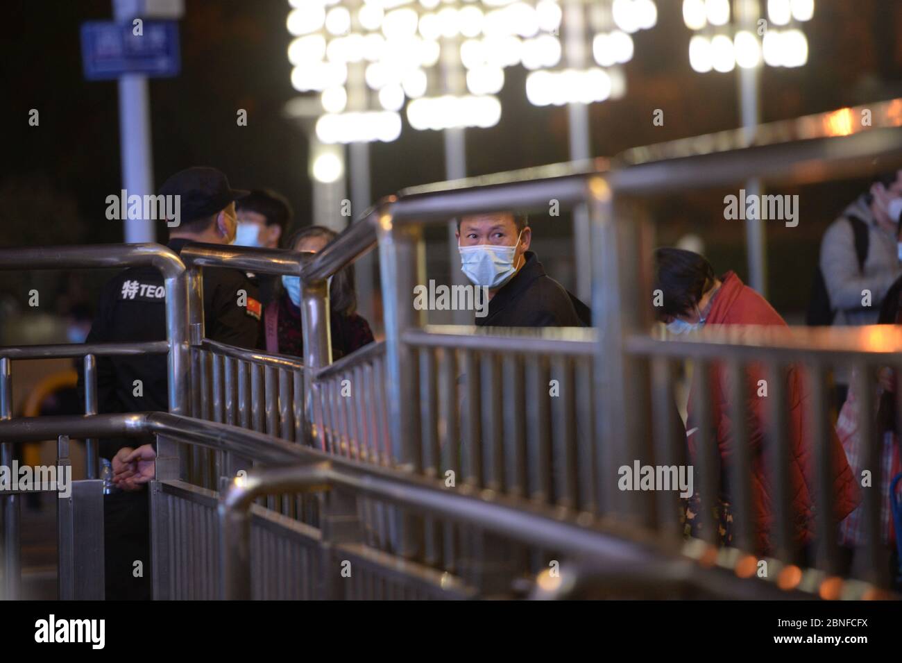 Passengers wait at the train station to leave the city as the lockdown ends, Wuhan city, central China's Hubei province, at midnight of 8 April 2020. Stock Photo