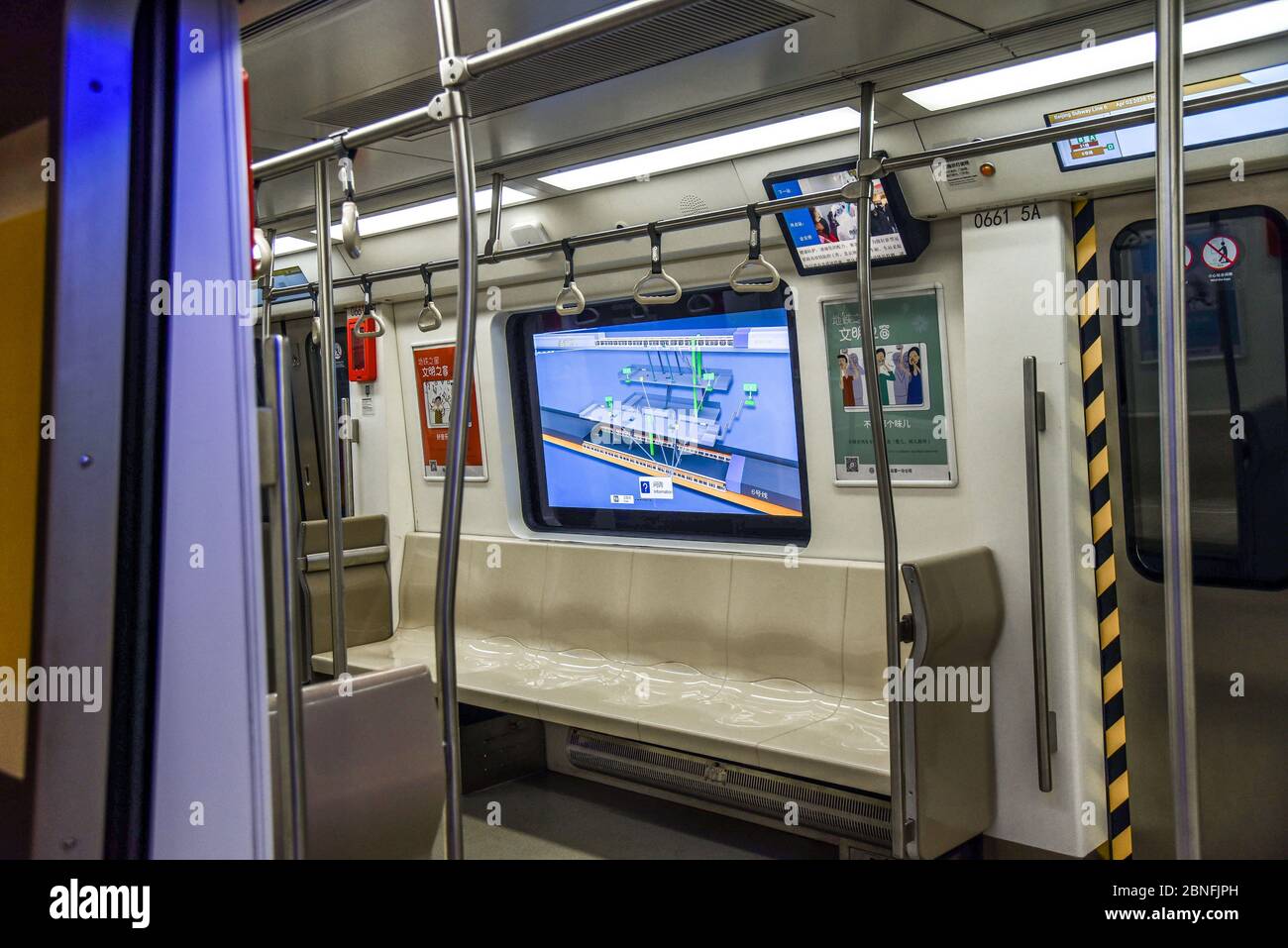 Students play online games inside a subway train in Beijing