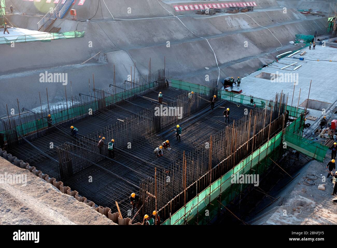 An Aerial View Of Workers With The Help Of Construction Machines an-aerial-view-of-workers-with-the-help-of-construction-machines