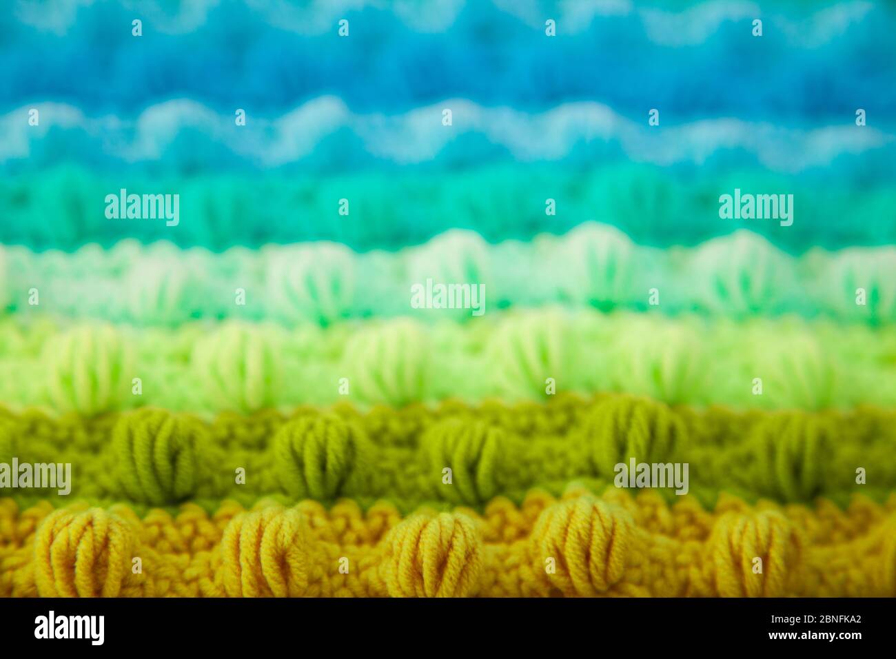 Knitted color background. Knitted texture. A sample of knitting from ...