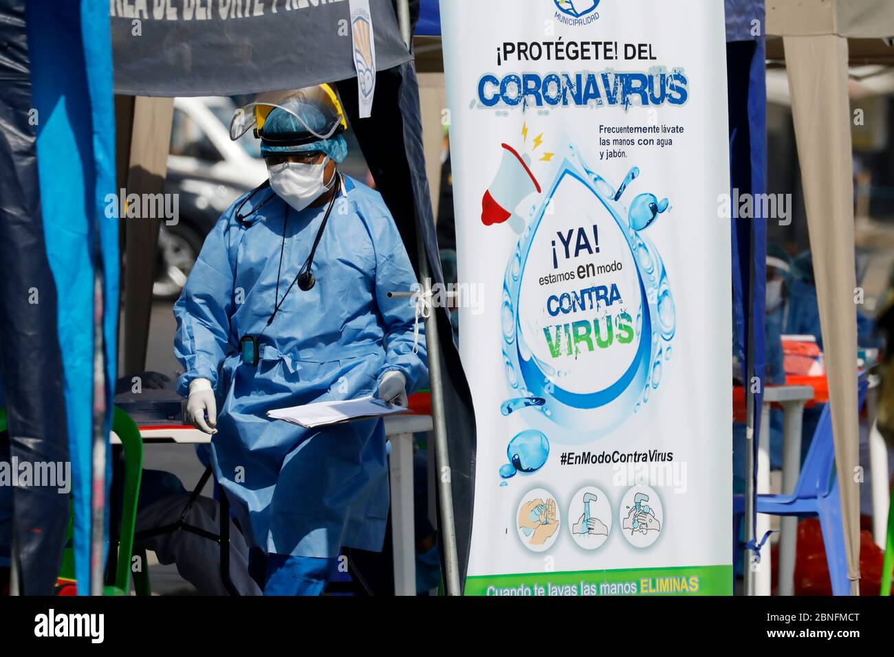 Lima, Peru. 14th May, 2020. A health care worker wearing protective gear .participates in a campaign to take blood rapid diagnostic tests for the new coronavirus disease, COVID-19 to market vendors at a market in Villa El Salvador Credit: Mariana Bazo/ZUMA Wire/Alamy Live News Stock Photo