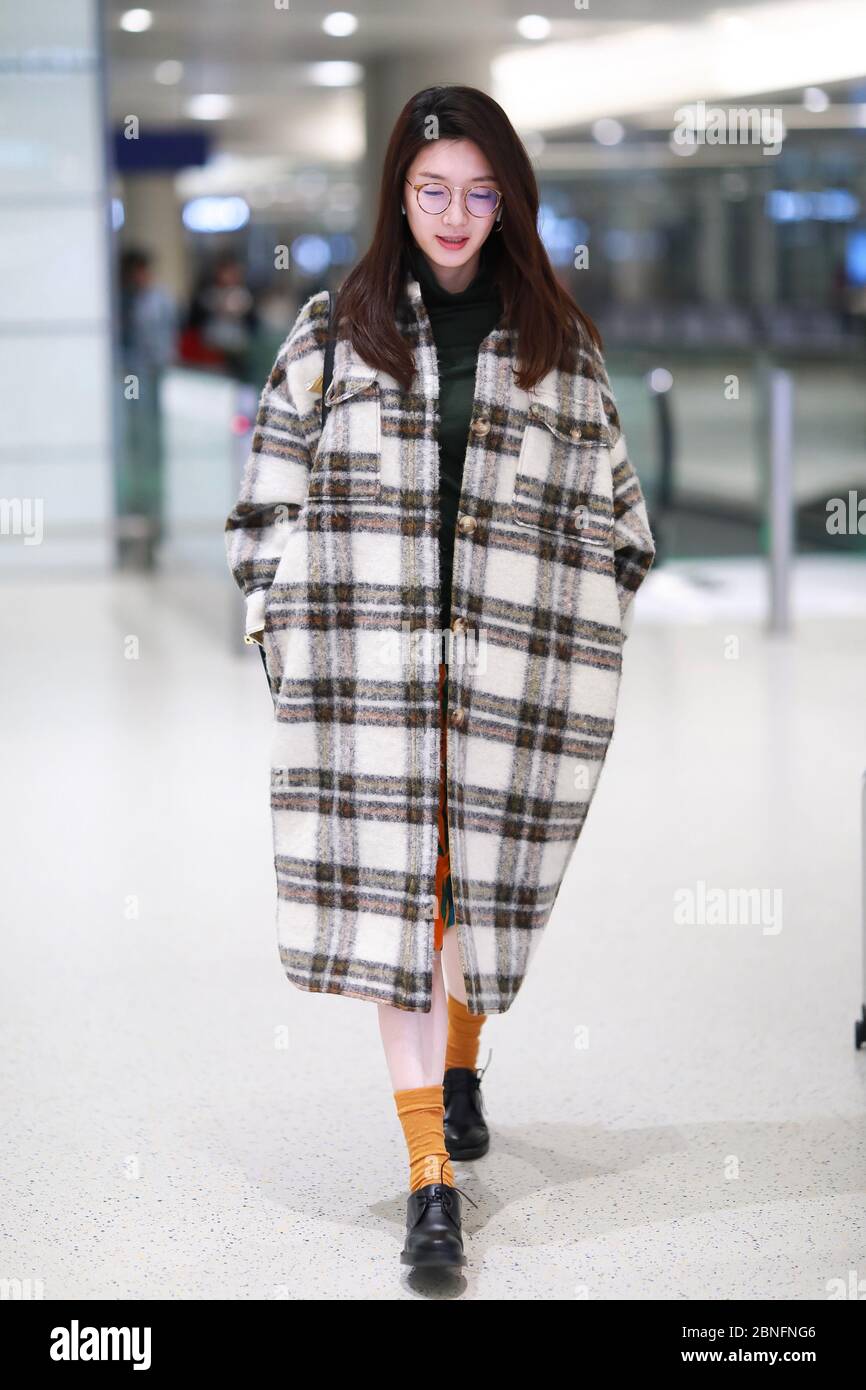 Chinese actress Jiang Shuying or Maggie Jiang arrives at a Shanghai airport before departure in Shanghai, China, 14 April 2020. Stock Photo