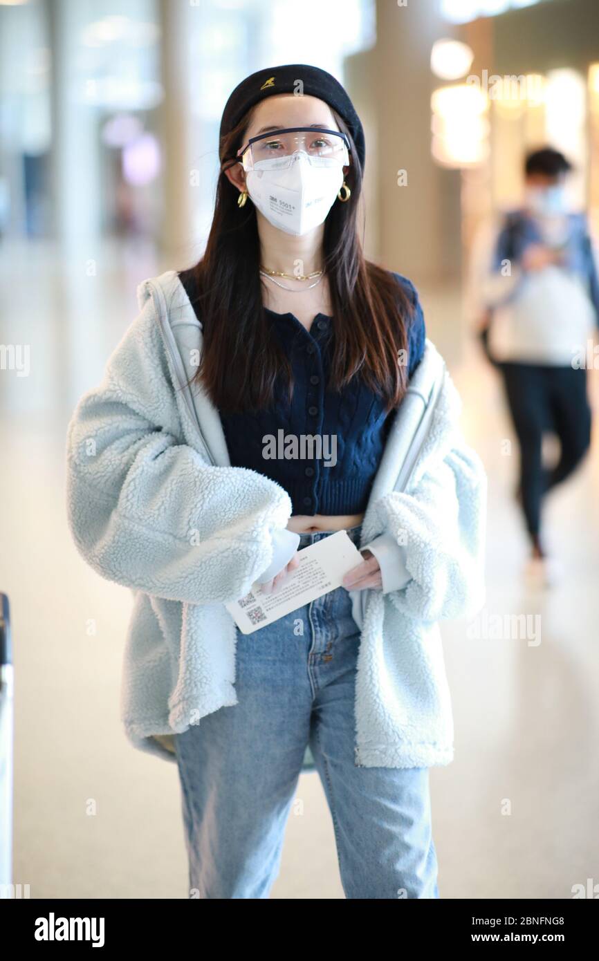 Chinese actress Jiang Mengjie arrives at a Shanghai airport before ...