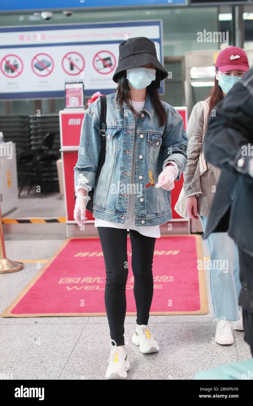 Chinese actress Tan Songyun arrives in an airport in Beijing, China ...