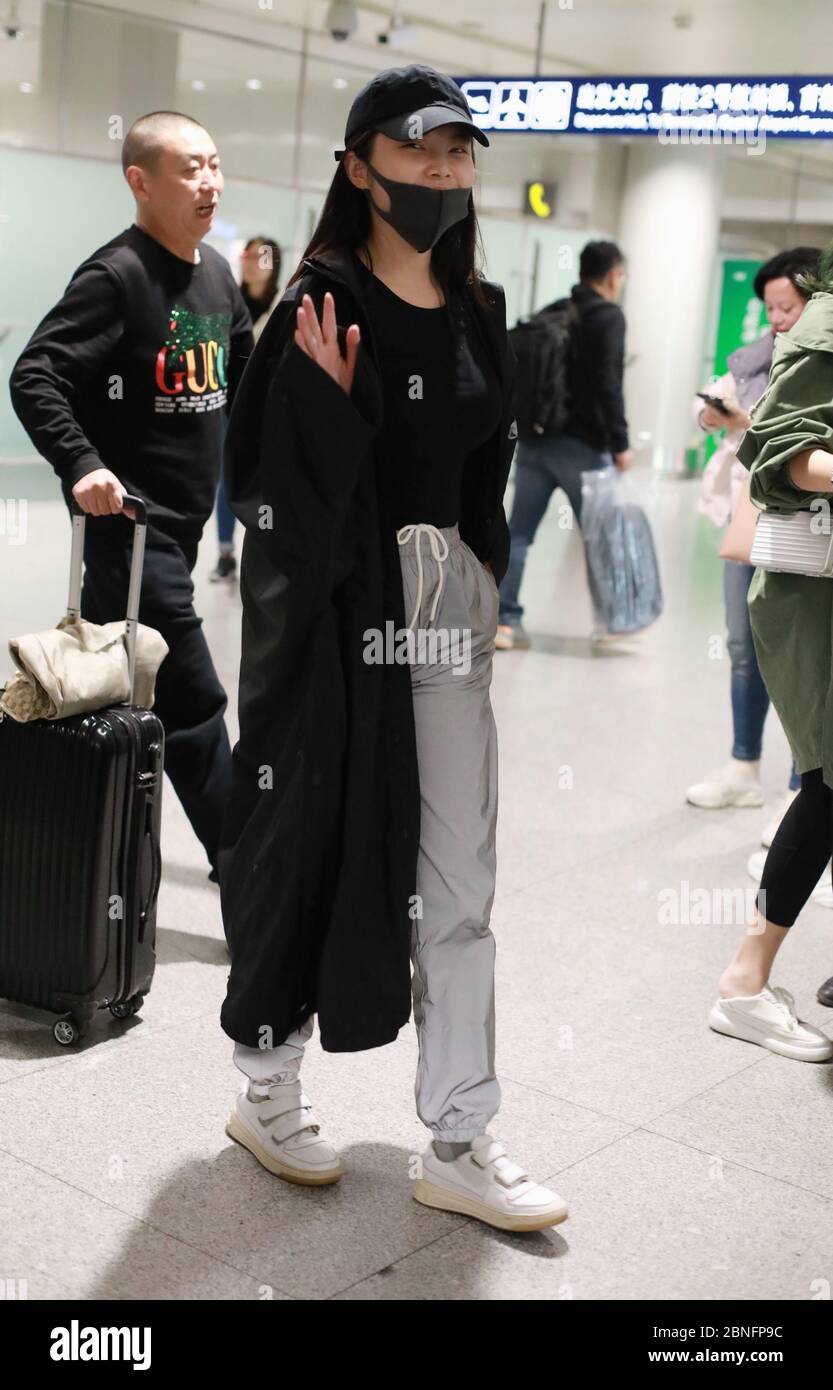 Chinese actress and singer Xu Dongdong arrives at a Beijing airport ...
