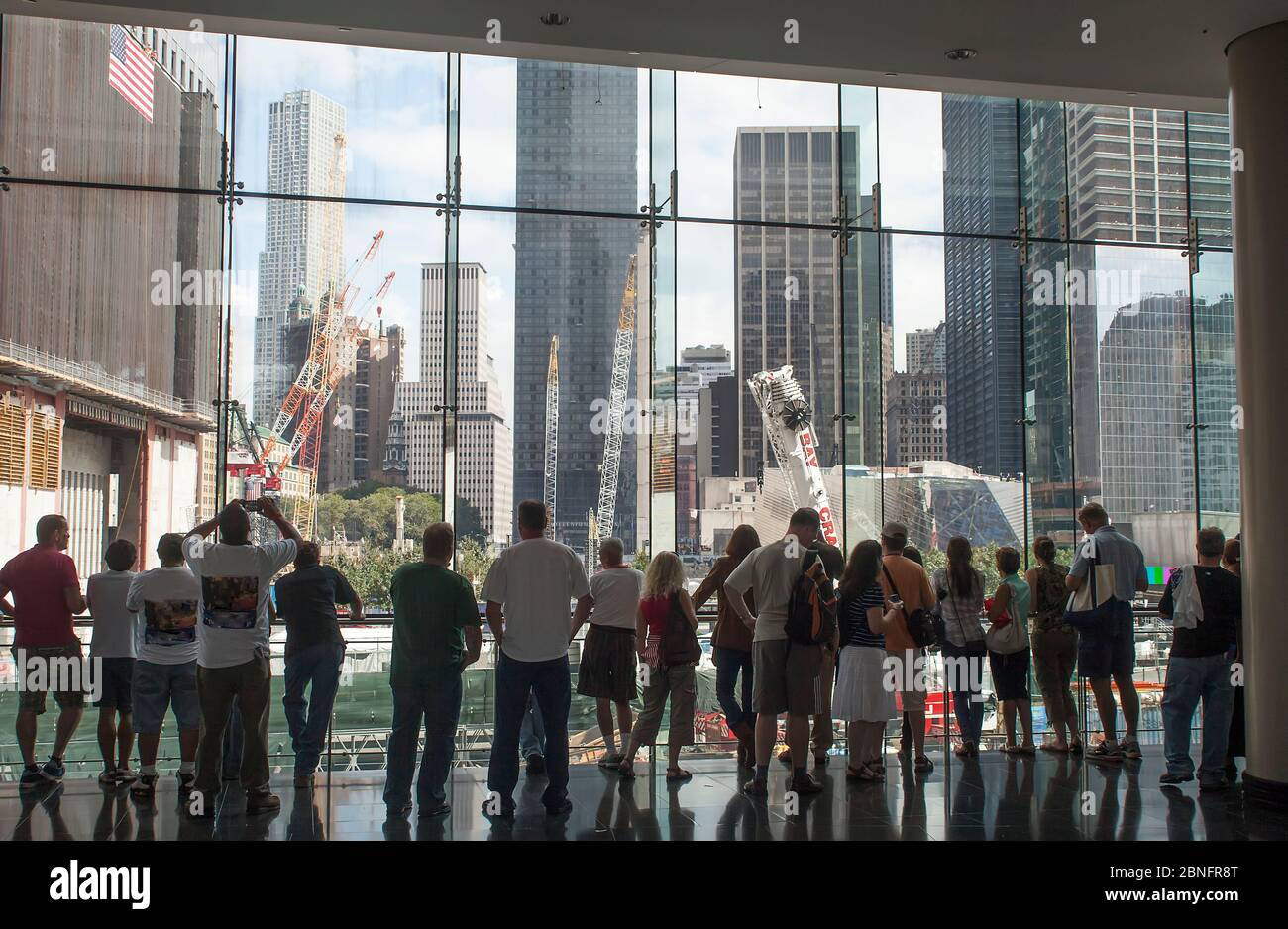 People look on during construction of One World Trade Center, Financial District, Manhattan, New York, USA Stock Photo