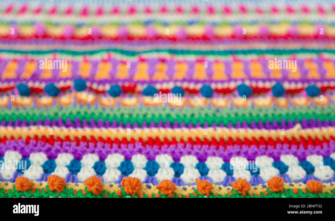 Knitted color background. Knitted texture. A sample of knitting from ...