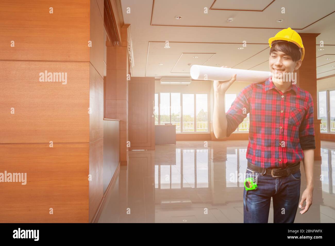 Engineer checking in decorate Interior room completed with hand holding ...