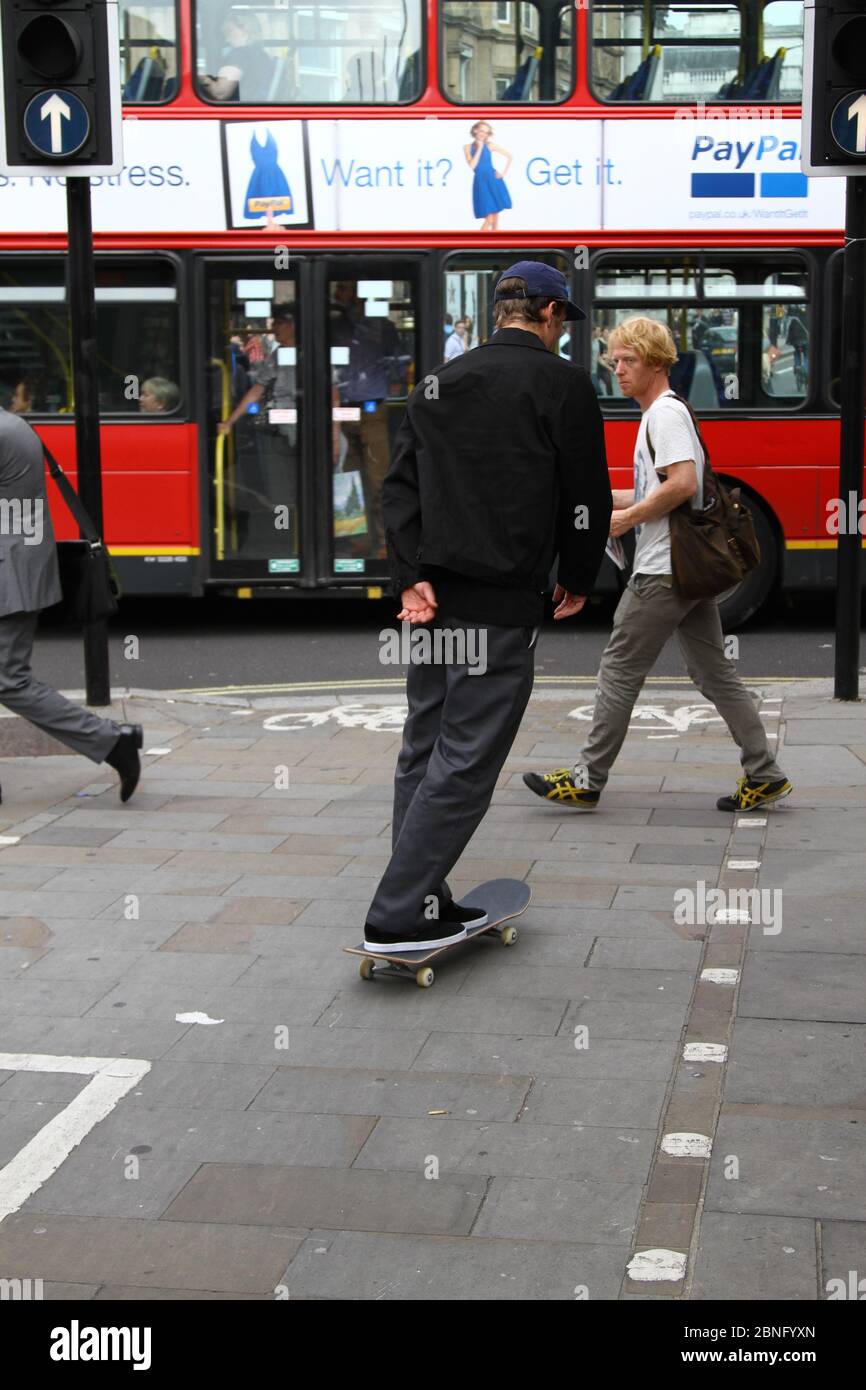 Cyclists and pedestrians. Road users. Cyclists and Motorists. Rules of the road. London traffic. London cycle lanes. Near misses. Close shave. Cycle lanes. Stay alert. Save lives. Danger. Every day living. complex lives. Bag of nerves. Cycling. Public spaces. Other road users. Dangerous riding. Driving. Walking. Urban living. Busy lives. Life in the city. City living. Life in your hands. Risk. Keeping active. Stock Photo