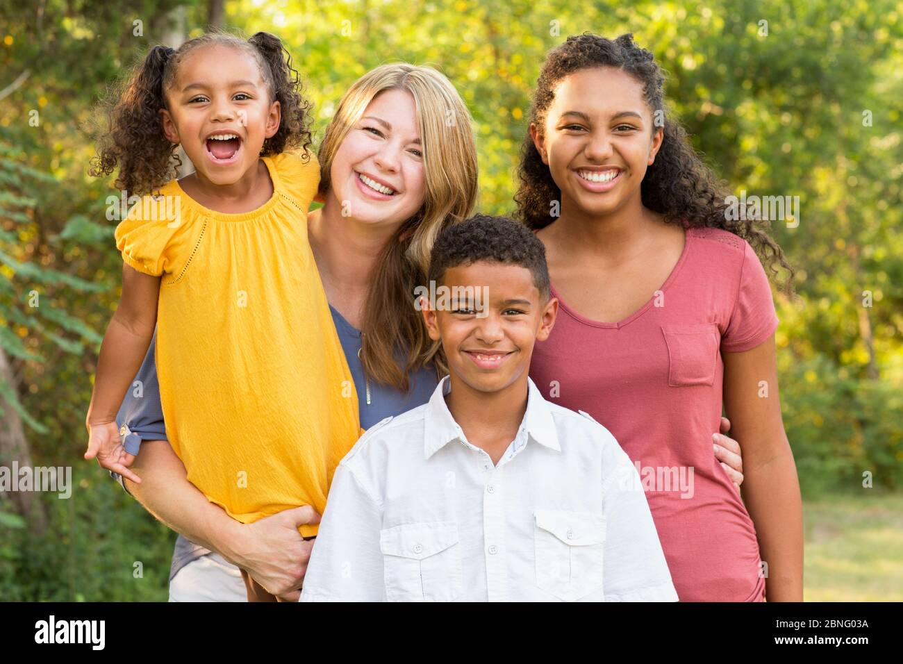 Portrait of a happy mixed race family smiling Stock Photo