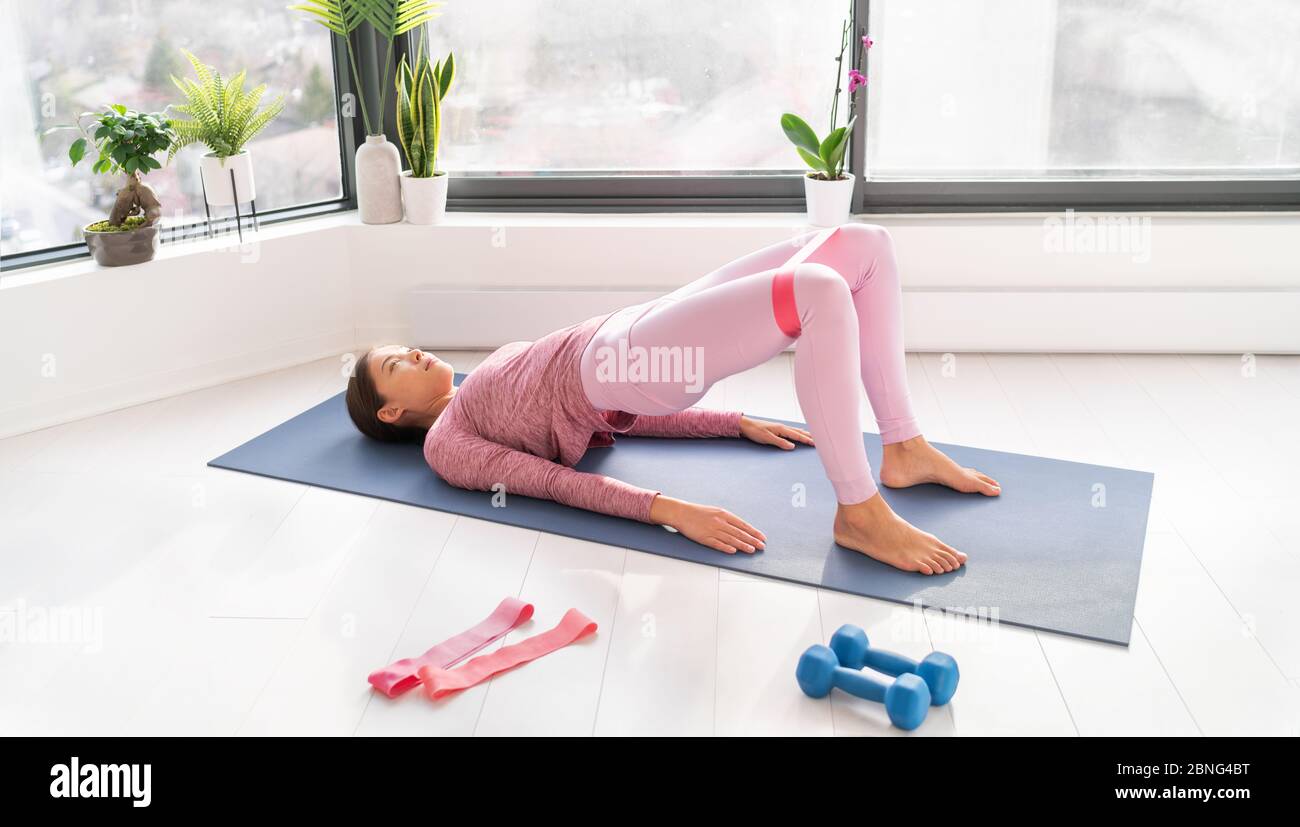 Resistance bands exercise glute bridge leg workout with loop band for strength training of legs and booty fitness Stock Photo Alamy
