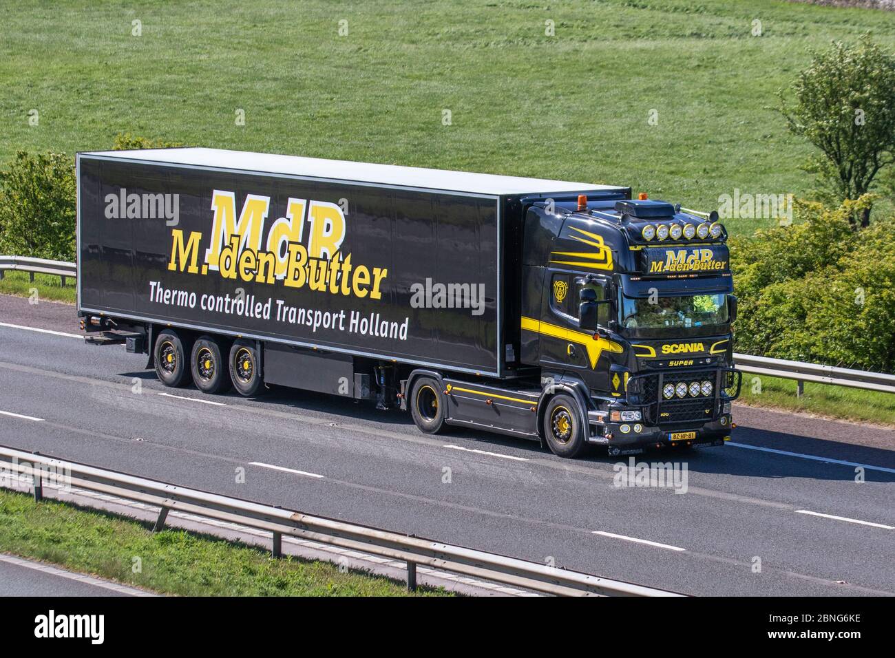 M.Den Butter ; MdB HGV Thermo controlled Haulage delivery trucks, lorry, transportation, truck, cargo carrier, vehicle, European Dutch commercial transport industry, distribution service M6 at Manchester, UK Stock Photo