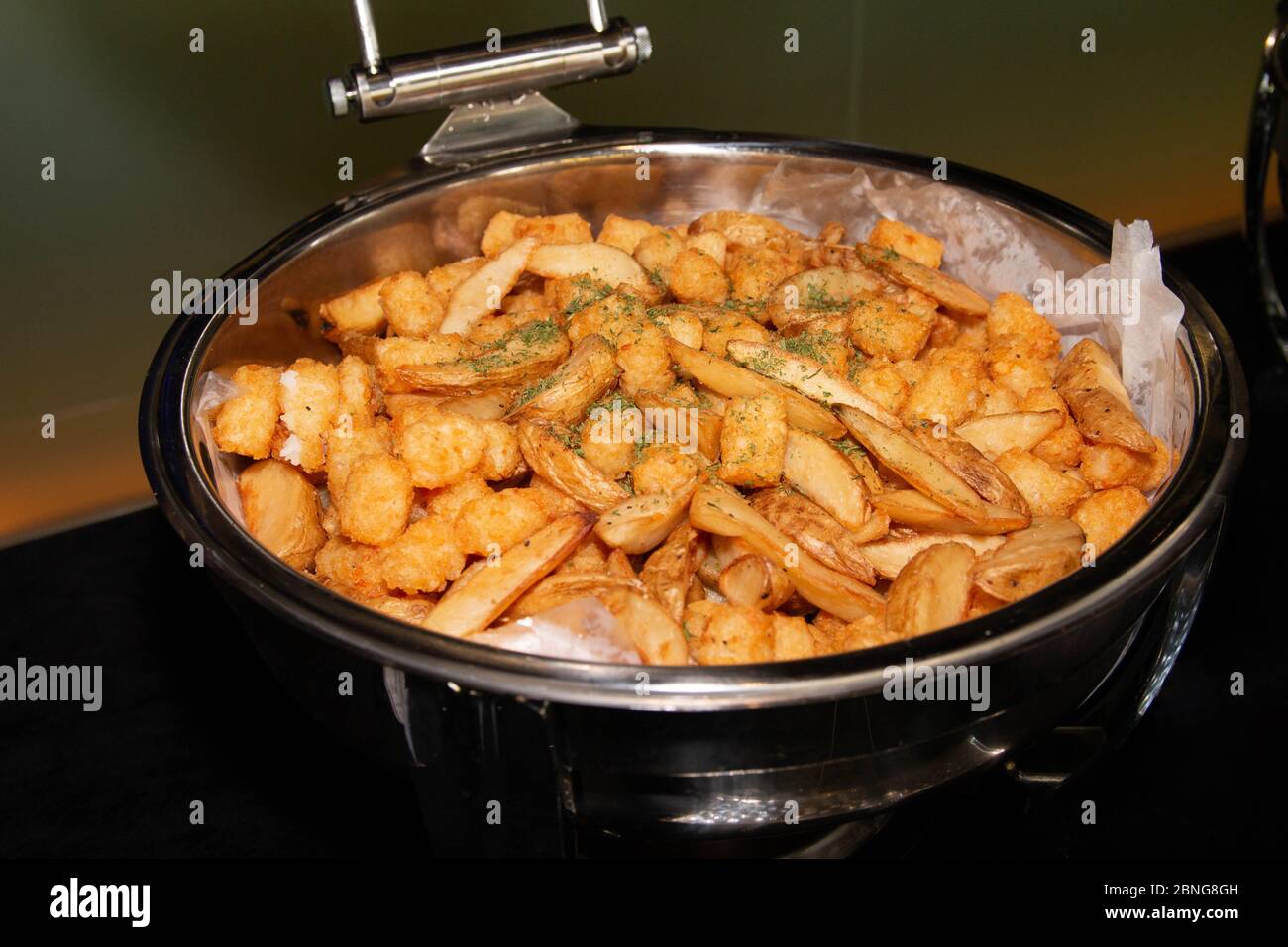 Stainless hotel pans on food warmers with various meals. Roasted meat  pieces with vegetable. Self-service buffet table. Celebration, party,  wedding Stock Photo - Alamy