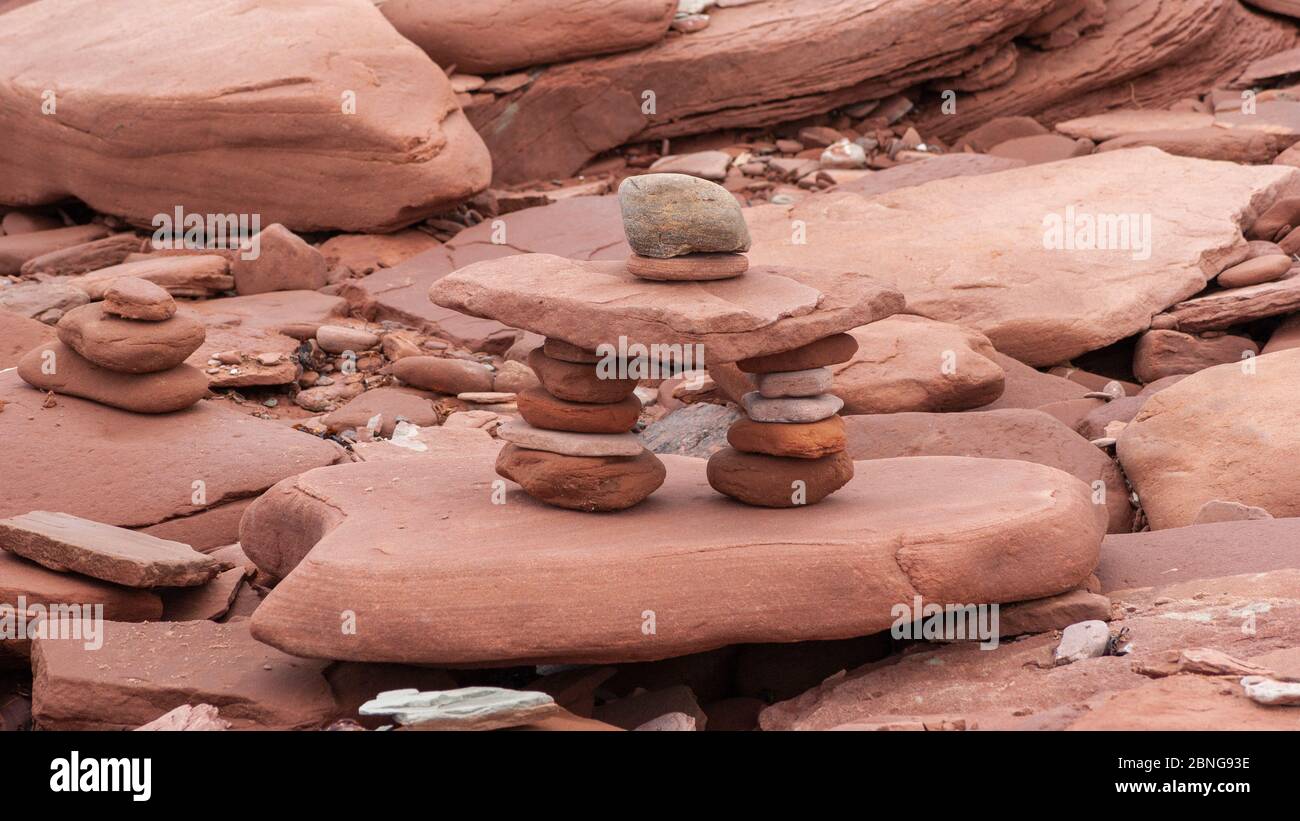 Inuksuk – a manmade landmark from balancing red sandstones, at 