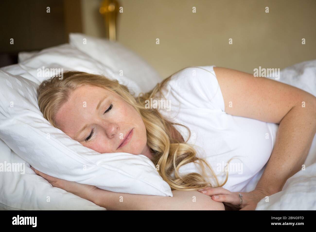 Beautiful woman getting a good night sleep. Stock Photo