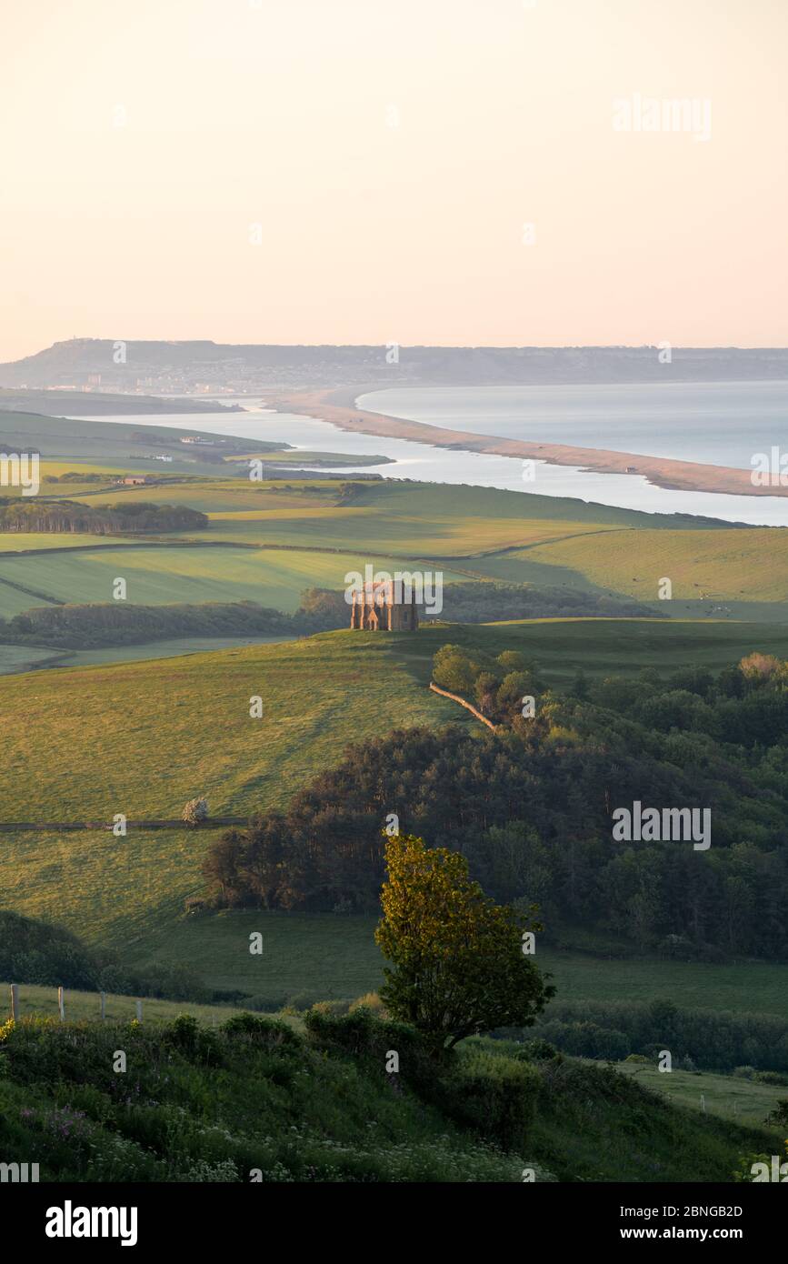 Abbotsbury, Dorset, UK. 15th MAY, 2020. UK Weather. Crisp clear and cold sunrise. St Catherine's Chapel just catching the first rays of sunlight on the south coast of Dorset. Credit: Dan Tucker/Alamy Live Stock Photo