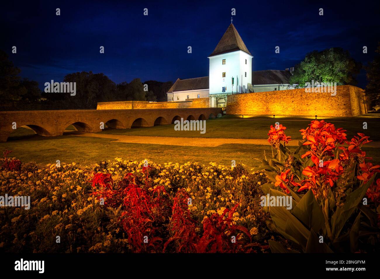 Evening view of the fortress in Sarvar. Beautiful color appearance. The illuminated castle, Plants and Trees Stock Photo