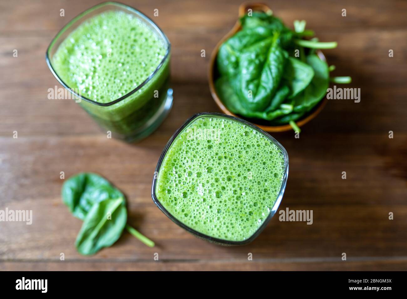 Spinach smoothie made with banana, baby spinach and spirulina powder