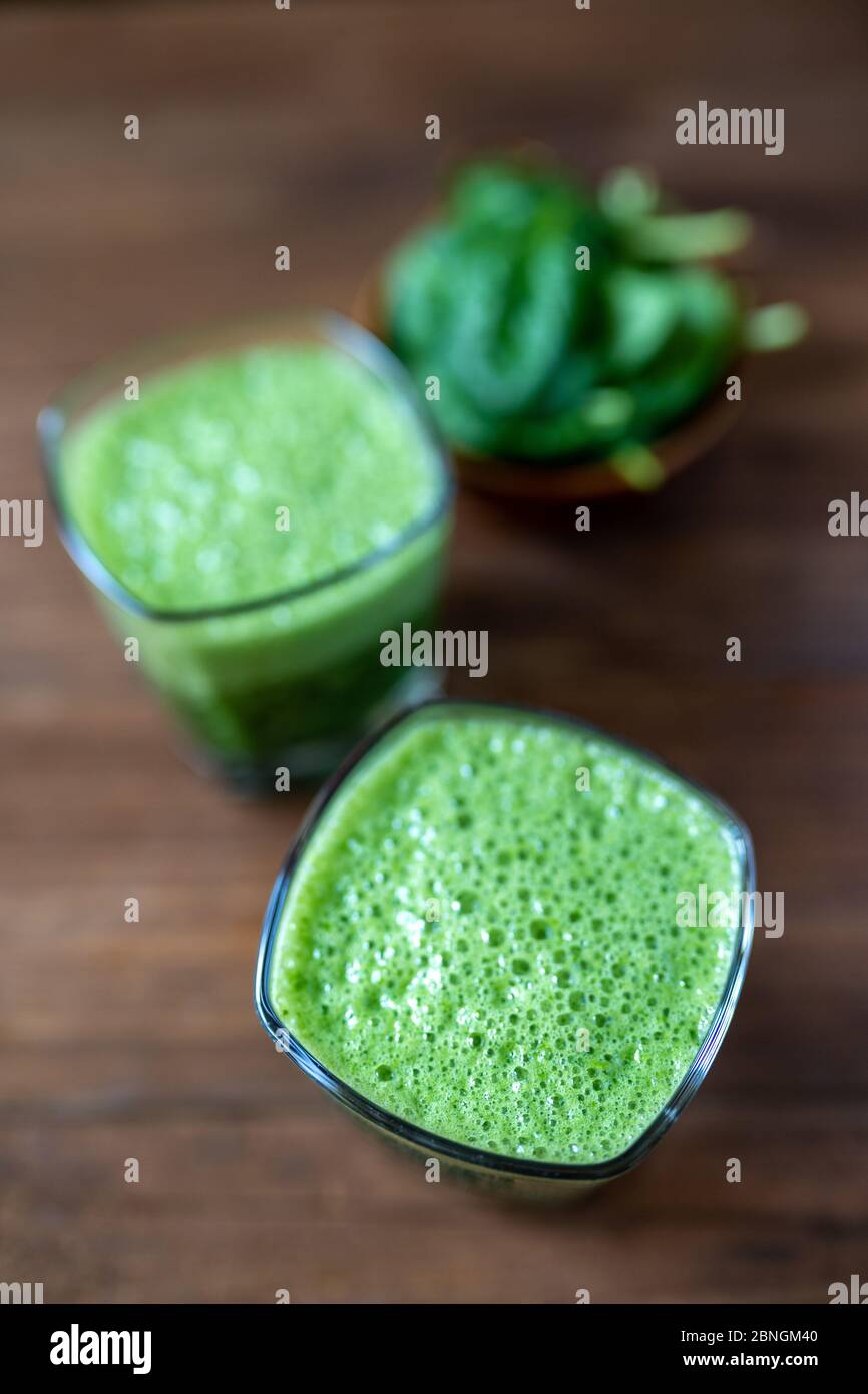 Spinach smoothie made with banana, baby spinach and spirulina powder