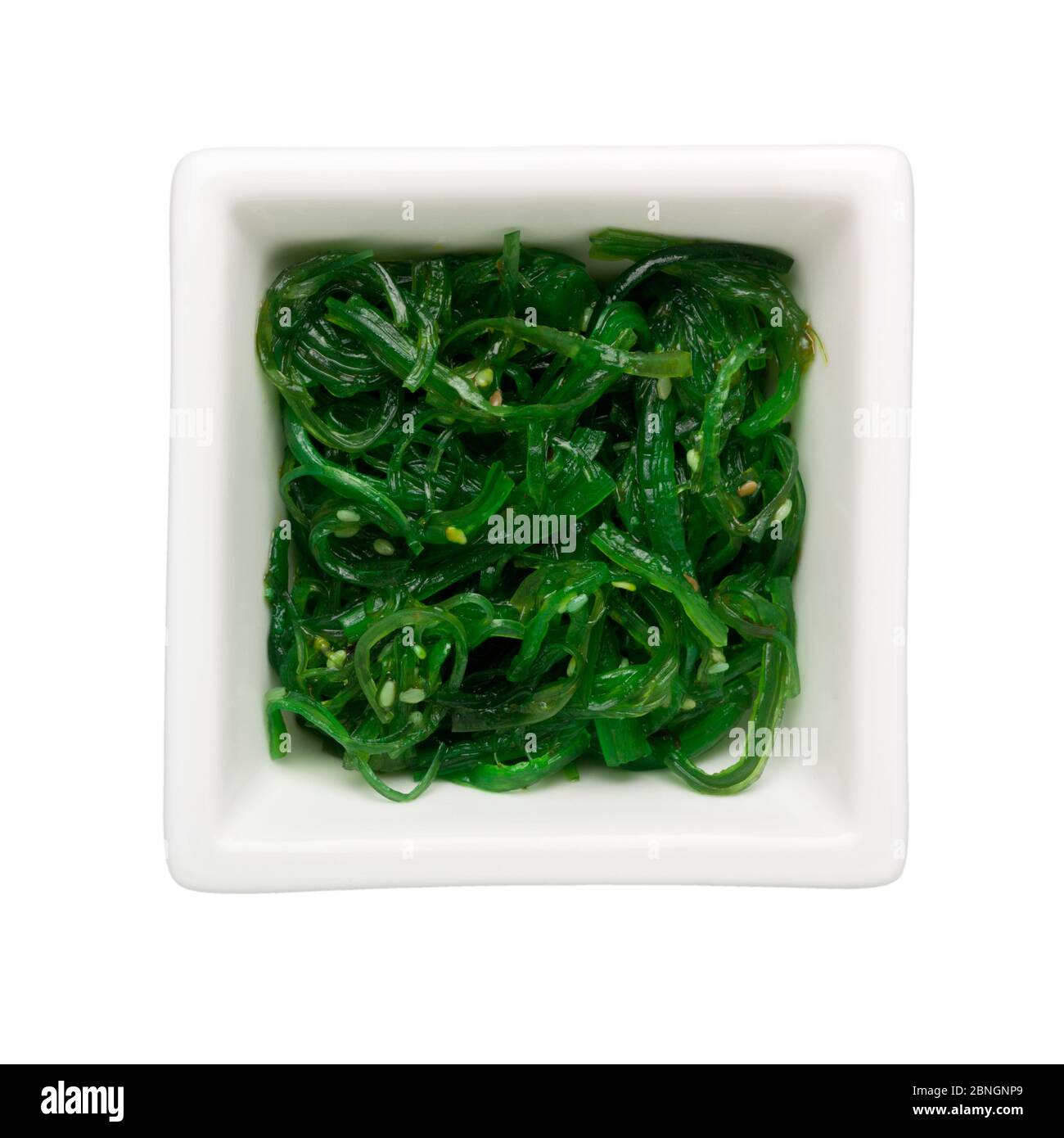 Ohitashi - Japanese vegetable salad in a square bowl isolated on white background Stock Photo