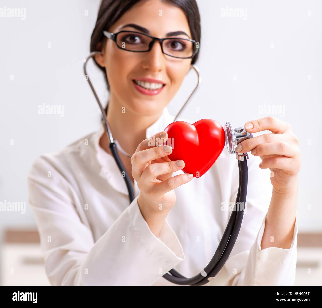 The young doctor in heart care concept Stock Photo Alamy