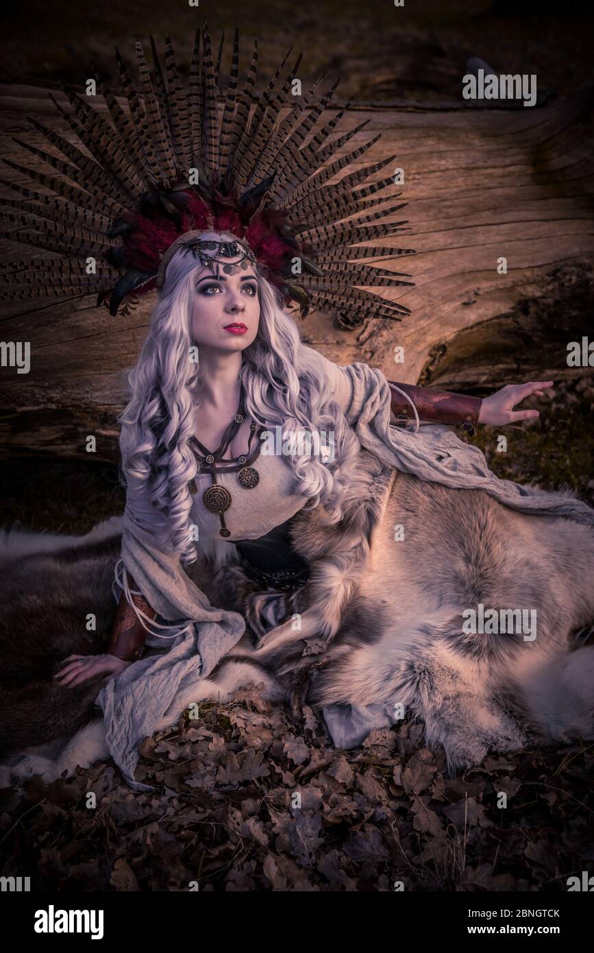 The Shamanic Priestess practices her rituals and arts at the close of the day Stock Photo