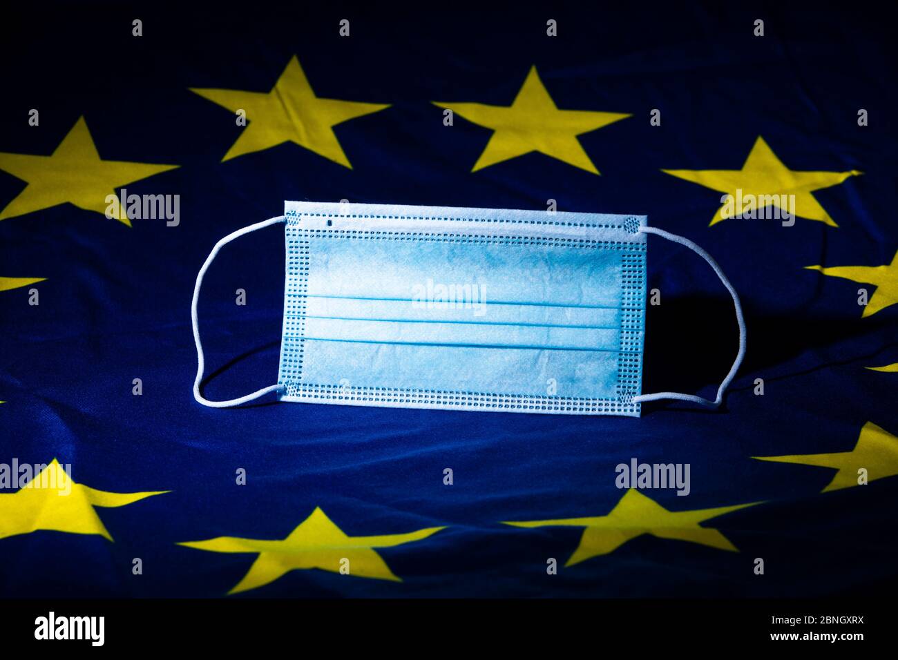 Flat face mask on a European flag illustrating a concept of health business Stock Photo