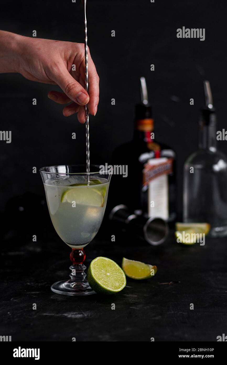 alcoholic drink with soda, lime and mint, on a dark background. home bar Stock Photo