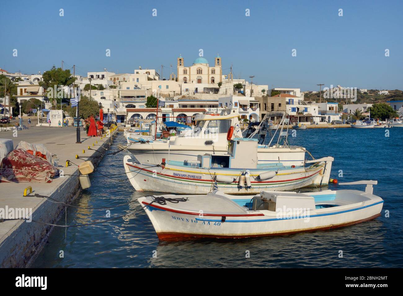 Moored fishing boats in Lipsi town harbour, with Agios Ioannis church in  the background, Lipsi, Dodecanese Islands, Greece, August 2013 Stock Photo  - Alamy