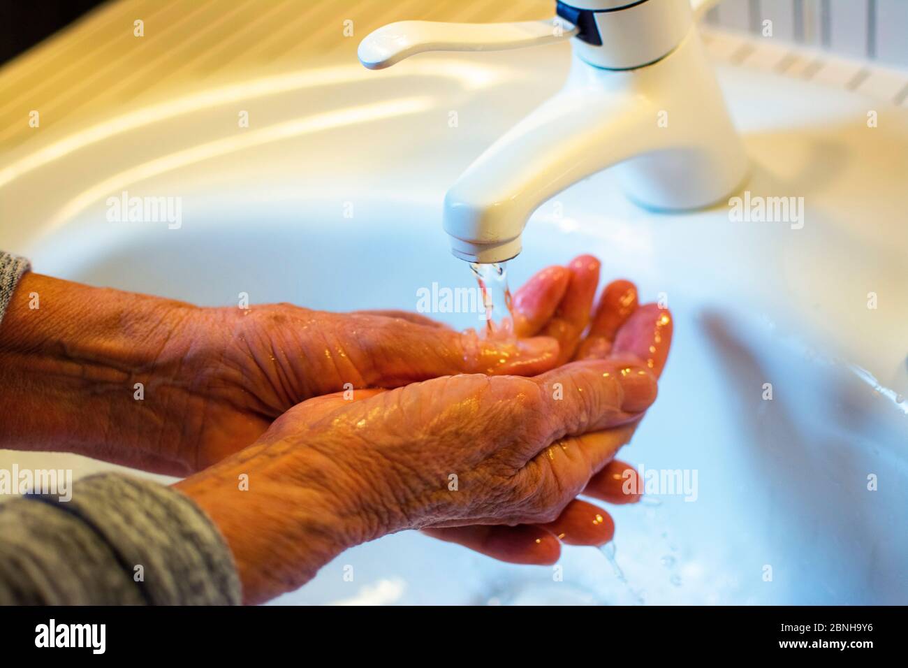 Washing hands in the bathroom Stock Photo
