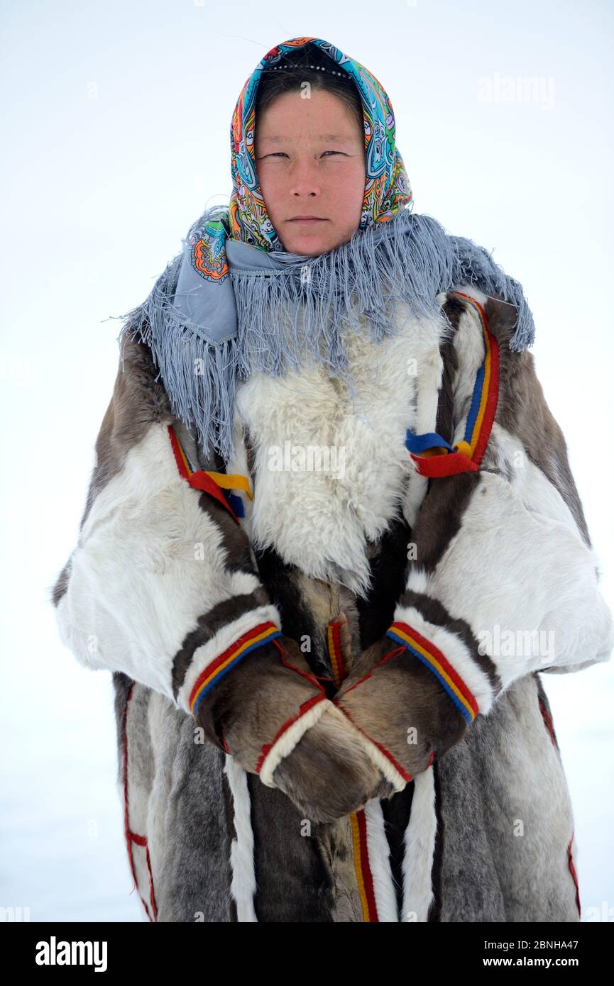 Ekaterina Yaptik, portrait of Nenet herder in winter coat of reindeer fur.  The collar is arctic fox fur with black beaver fur and felt ribbons. Yar-Sa  Stock Photo - Alamy