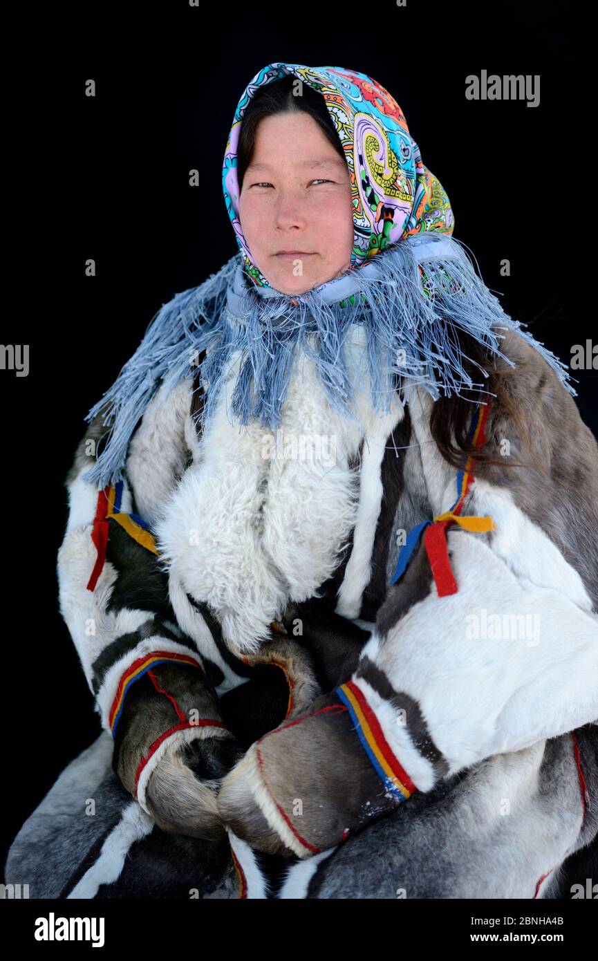 Ekaterina Yaptik, portrait of Nenet herder in winter coat of reindeer ...