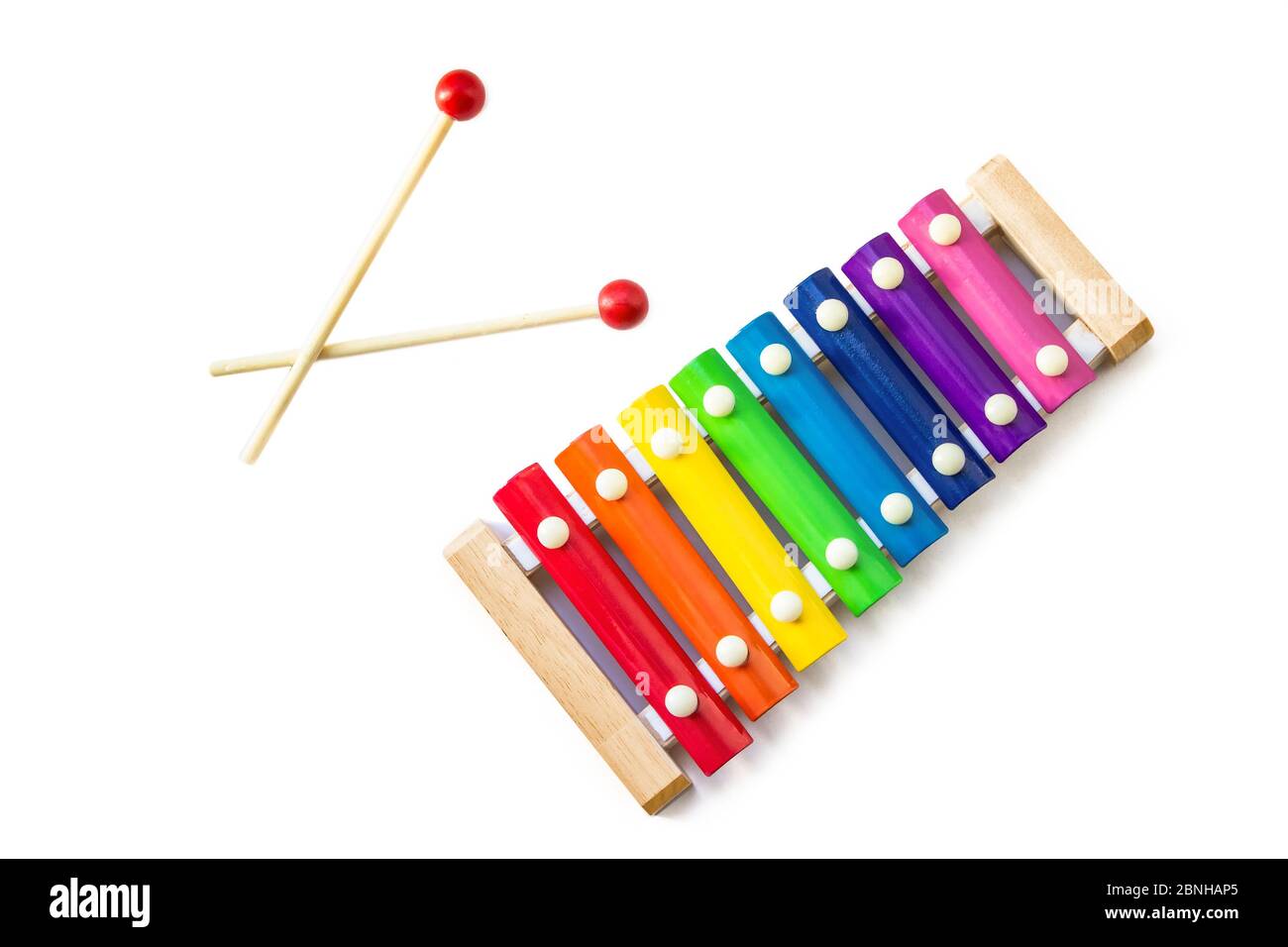 Rainbow Colored Wooden Toy 8 tone Xylophone glockenspiel isolated on white background with clipping path. toy glockenspiel made of metal and wood. Mus Stock Photo