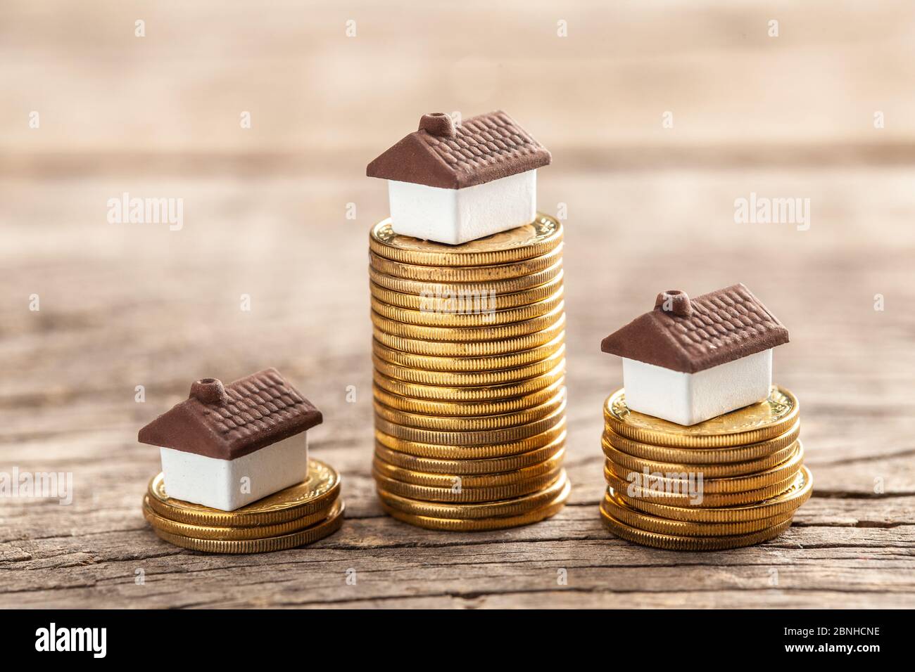 House and a stack of coins. The market price of the house. Real estate market growth Stock Photo